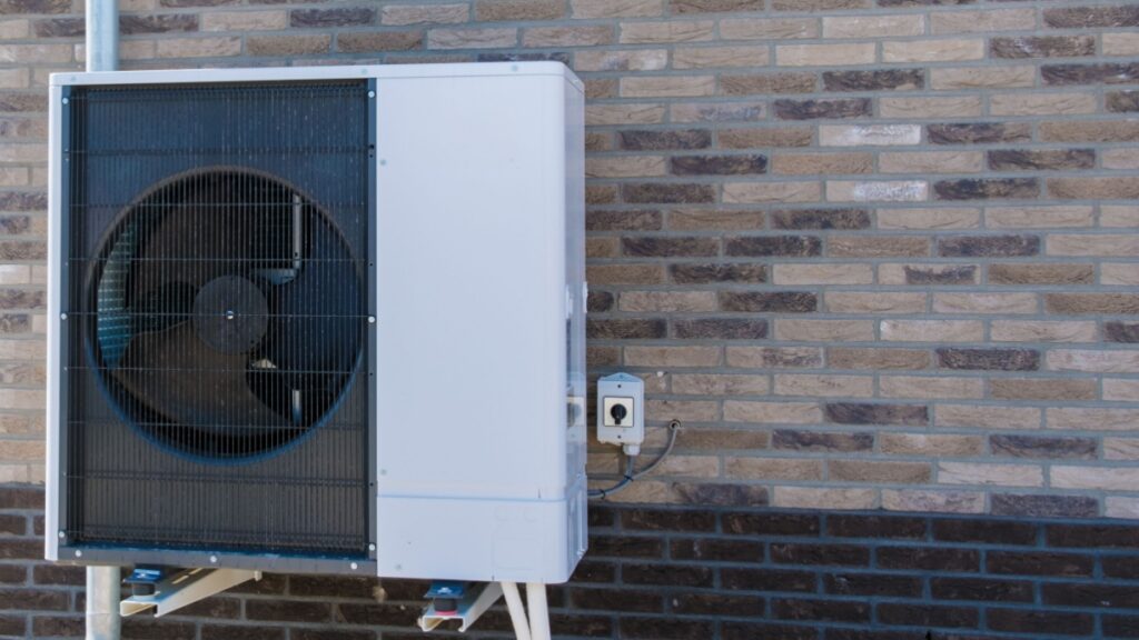 A heat pump unit installed outside of a home.