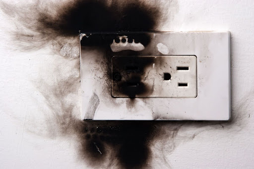 A burnt outlet on a wall.
